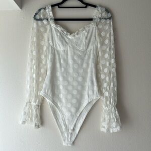 Parisian white polka dotted long sleeve bodysuit US 4